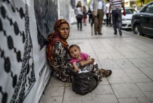 refugee mother in Istambul (The poor are always here to be helped)