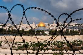 holy city through barbed wire