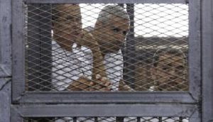 Al Jazeera journalists await liberation from Egyptian jail