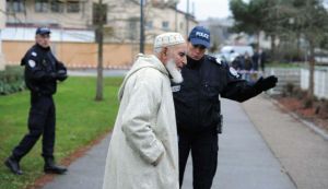 Police protect elderly worshiper